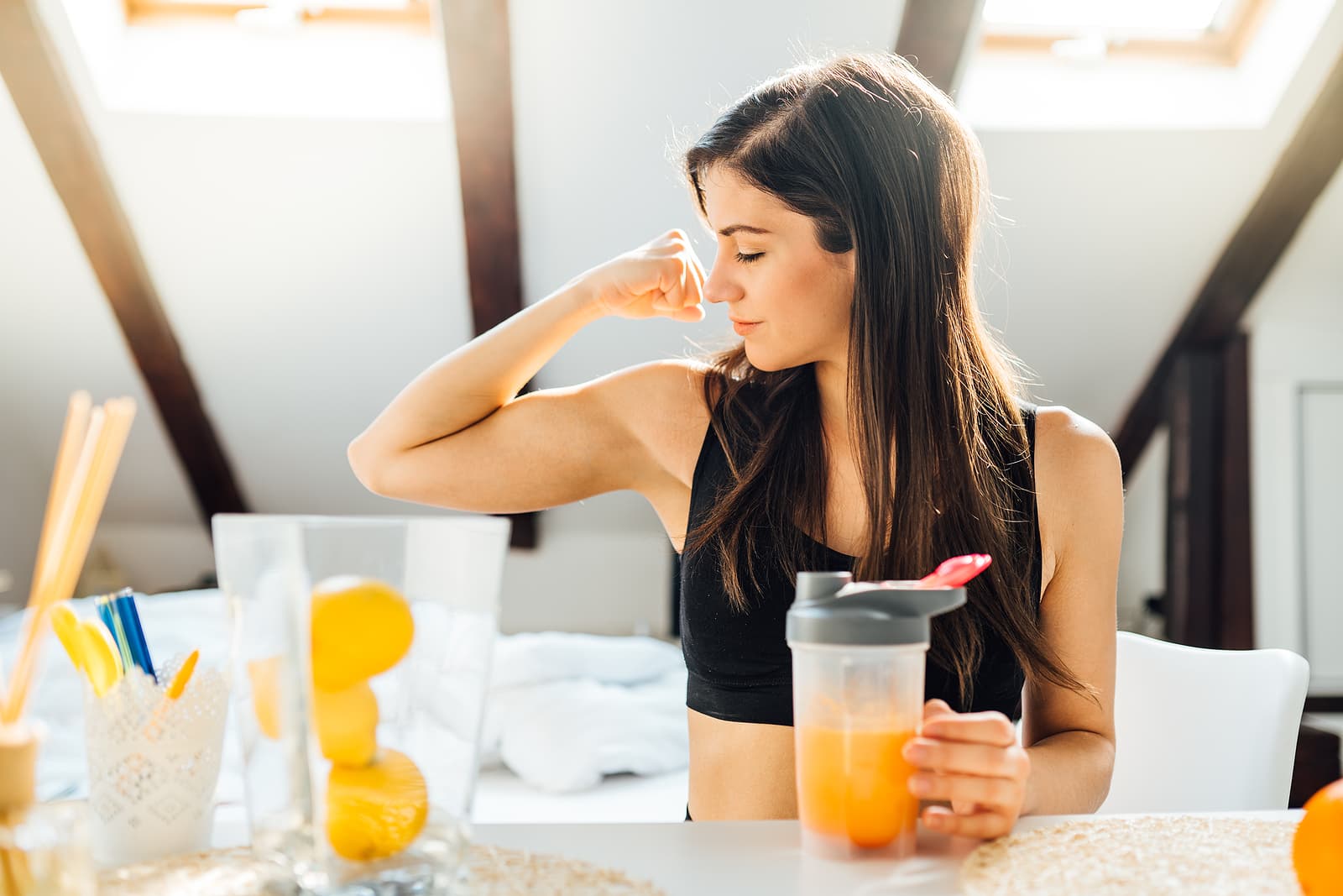 meal replacement diet plan - Woman at home drinking orange