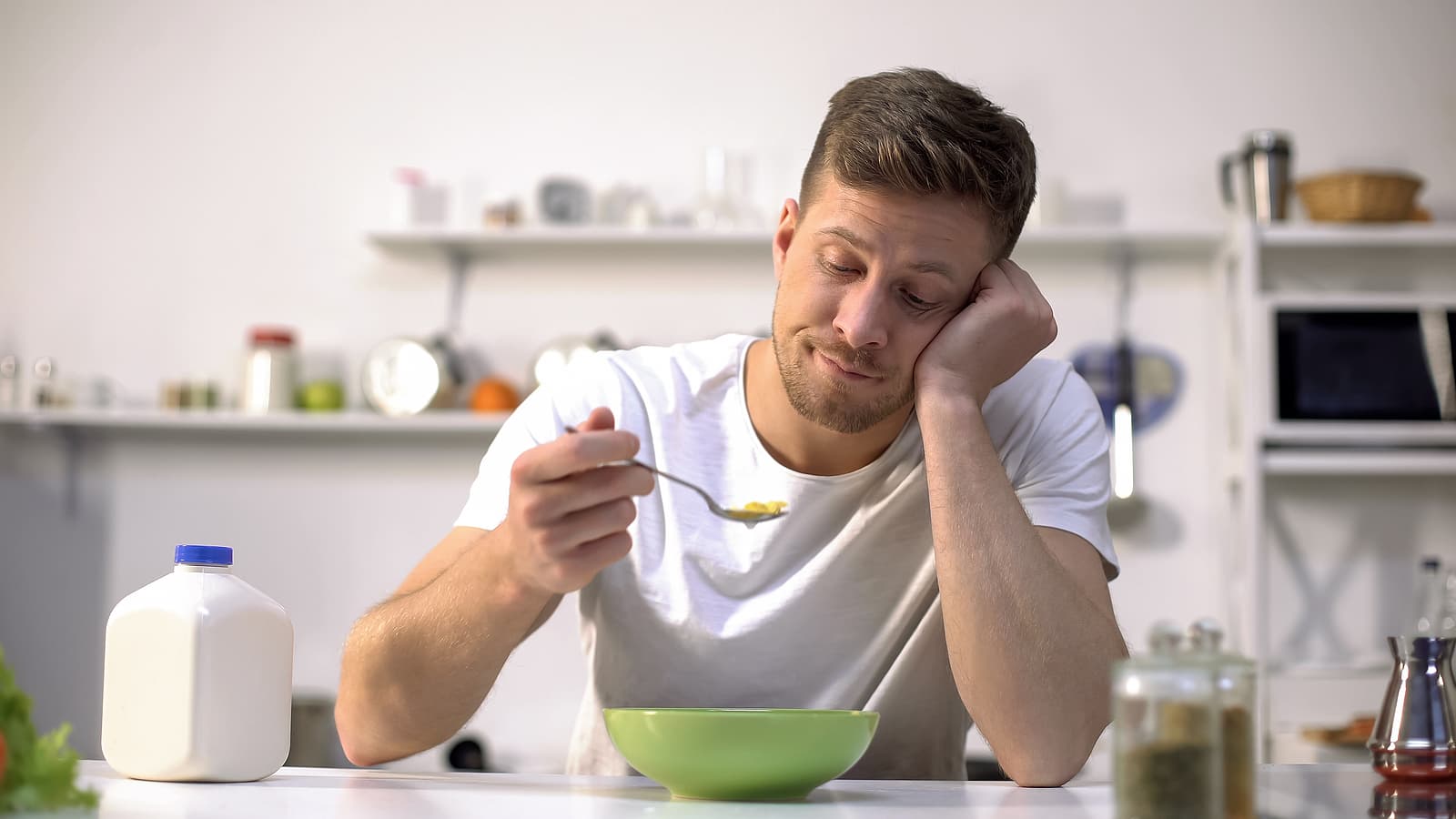 meal replacement protein shakes - single man eating tasteless cereals